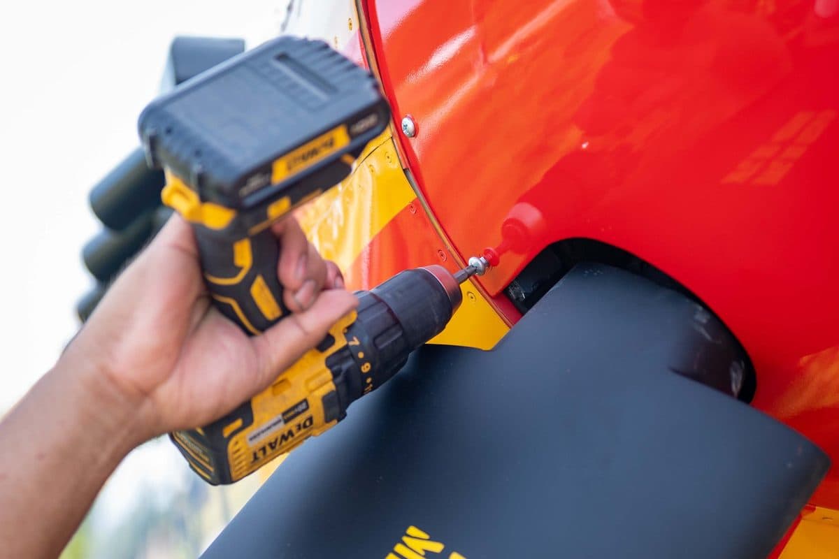 Tuskegee Airmen pilots standing near a P-51 Mustang fighter aircraft