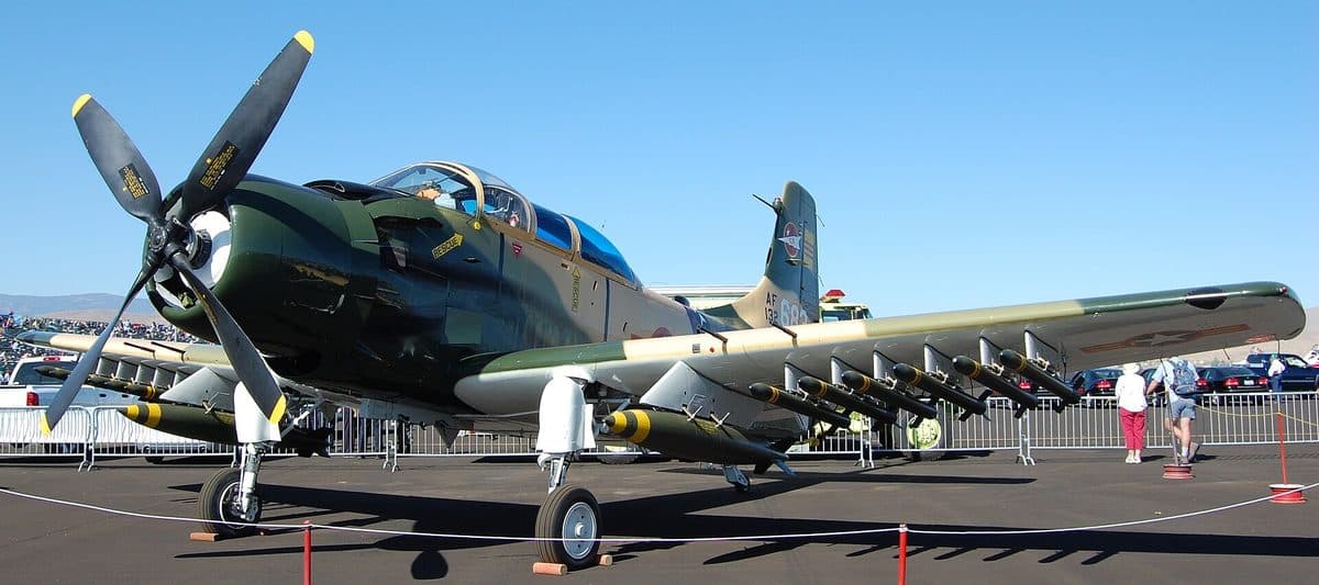A-1 Skyraider attack aircraft in flight showing its massive radial engine and underwing ordnance load
