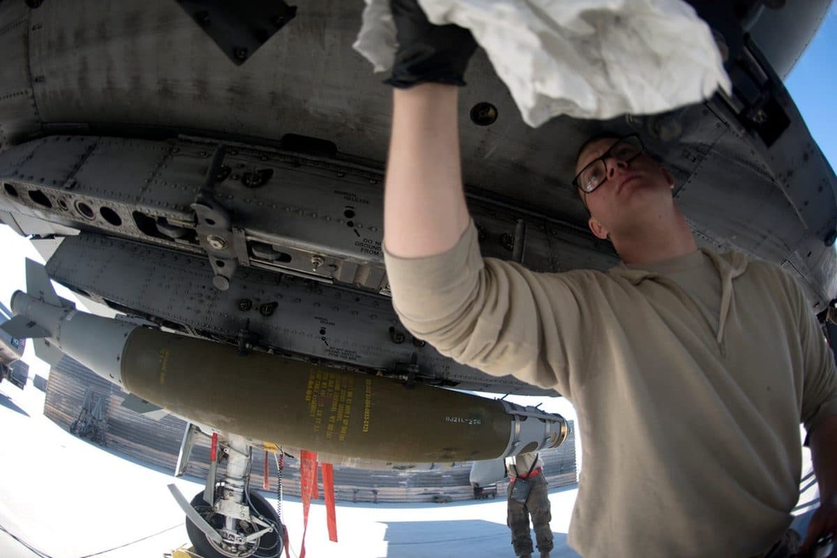 A-10 Warthog attack aircraft flying over desert terrain