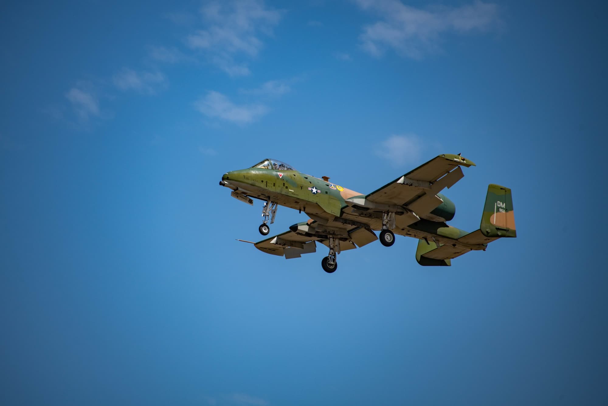 A-10 Thunderbolt II Warthog flying low over a desert landscape during a close air support mission