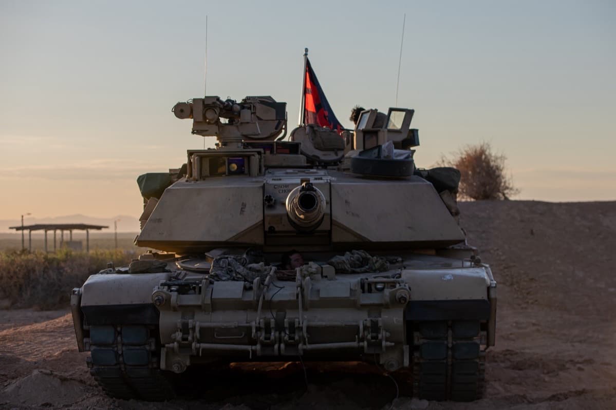 M1 Abrams tank head-on showing its massive frontal composite armor and 120mm main gun