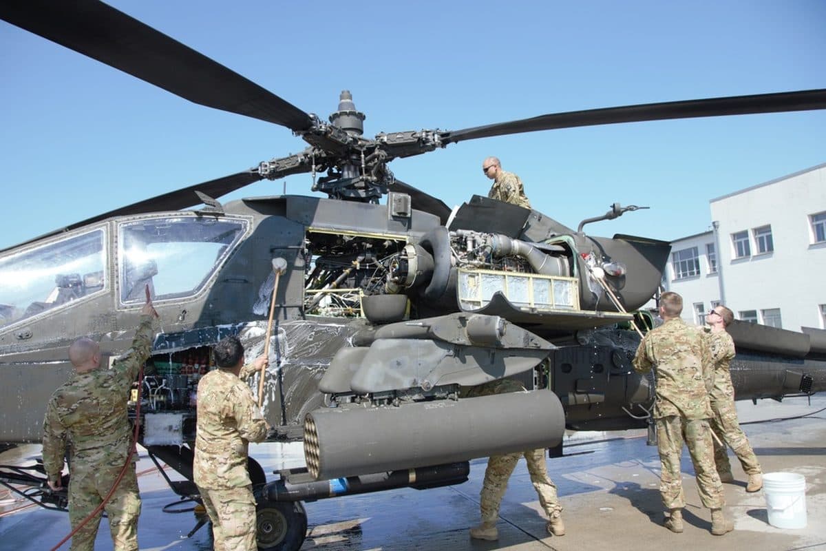 AH-64 Apache attack helicopter in flight during a military exercise