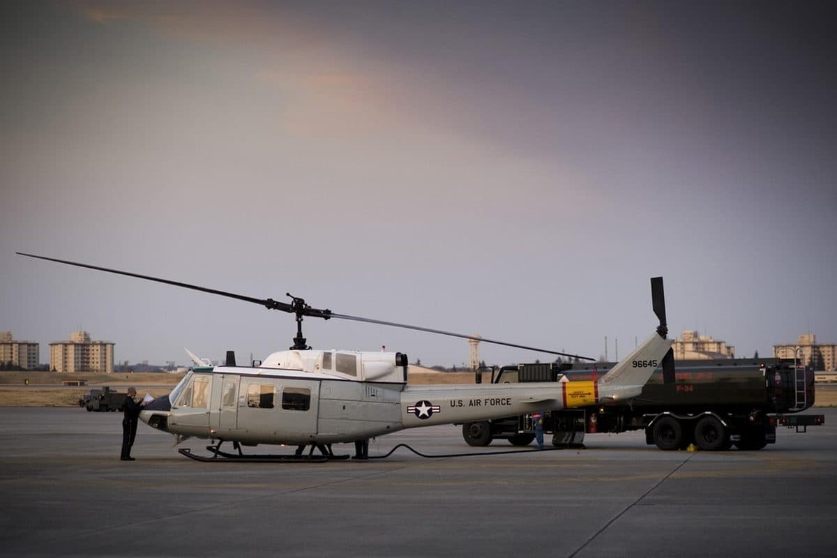Bell UH-1 Iroquois utility helicopter hovering over a landing zone
