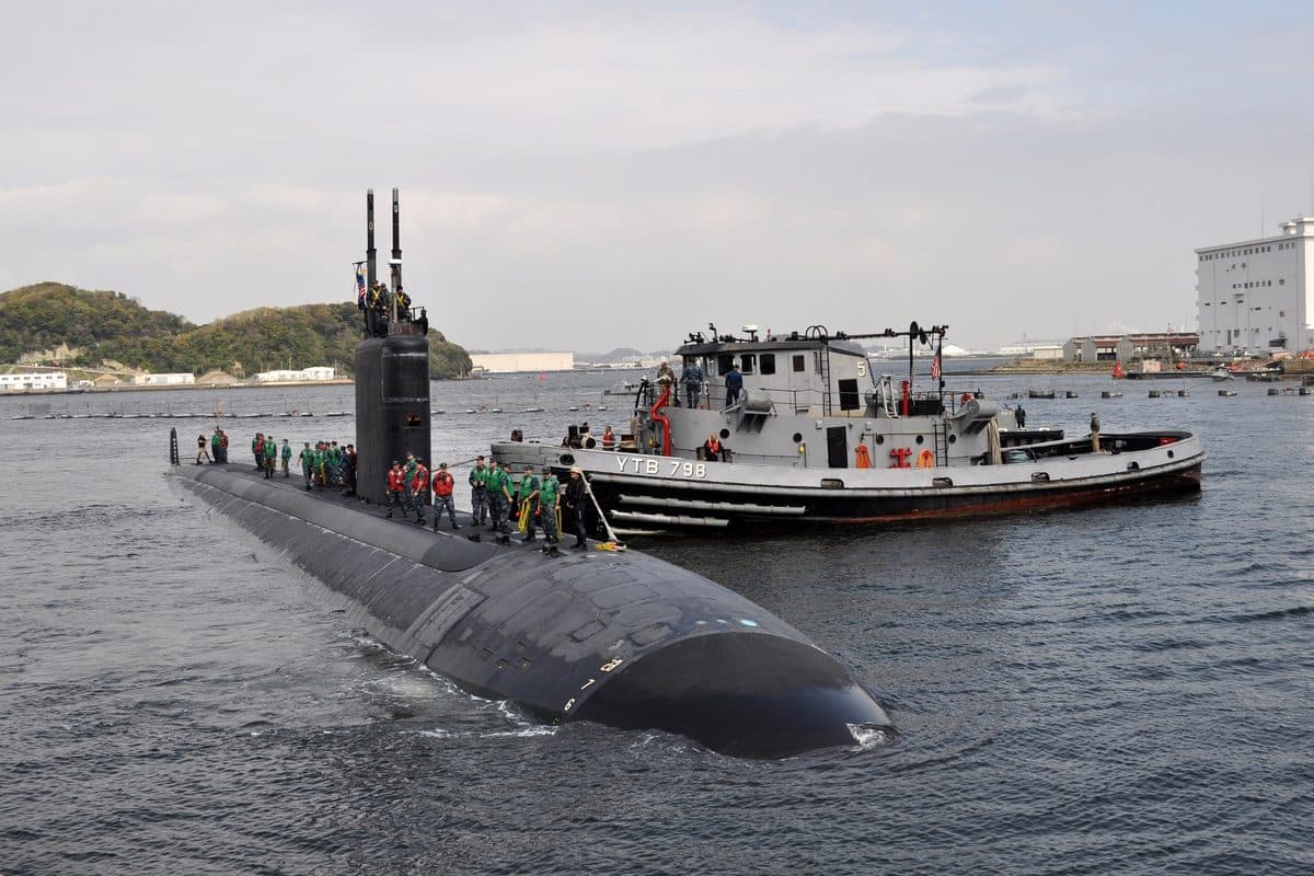 Virginia-class submarine surfacing in open ocean