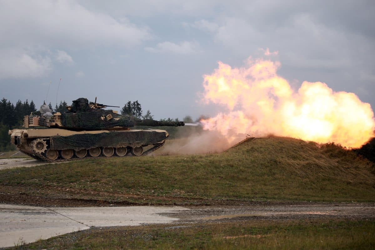 M1A1 Abrams tank in woodland camouflage fires its main gun during live-fire training at Grafenwoehr, Germany