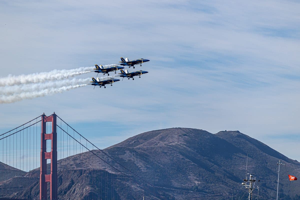 Blue Angels F/A-18 Super Hornets fly in tight diamond formation over San Francisco during Fleet Week 2024