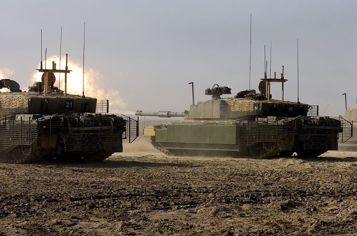 Challenger 2 main battle tank moving across terrain showing its distinctive profile and rifled gun barrel
