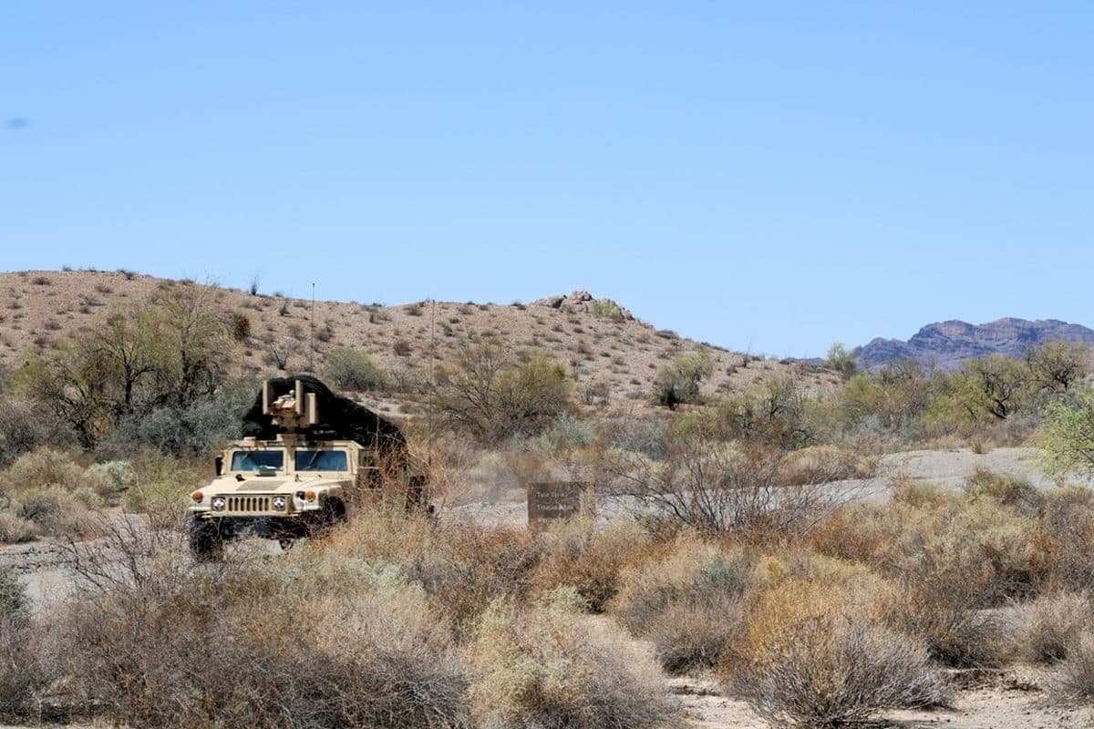 Desert Patrol Vehicle racing across sand dunes during operations