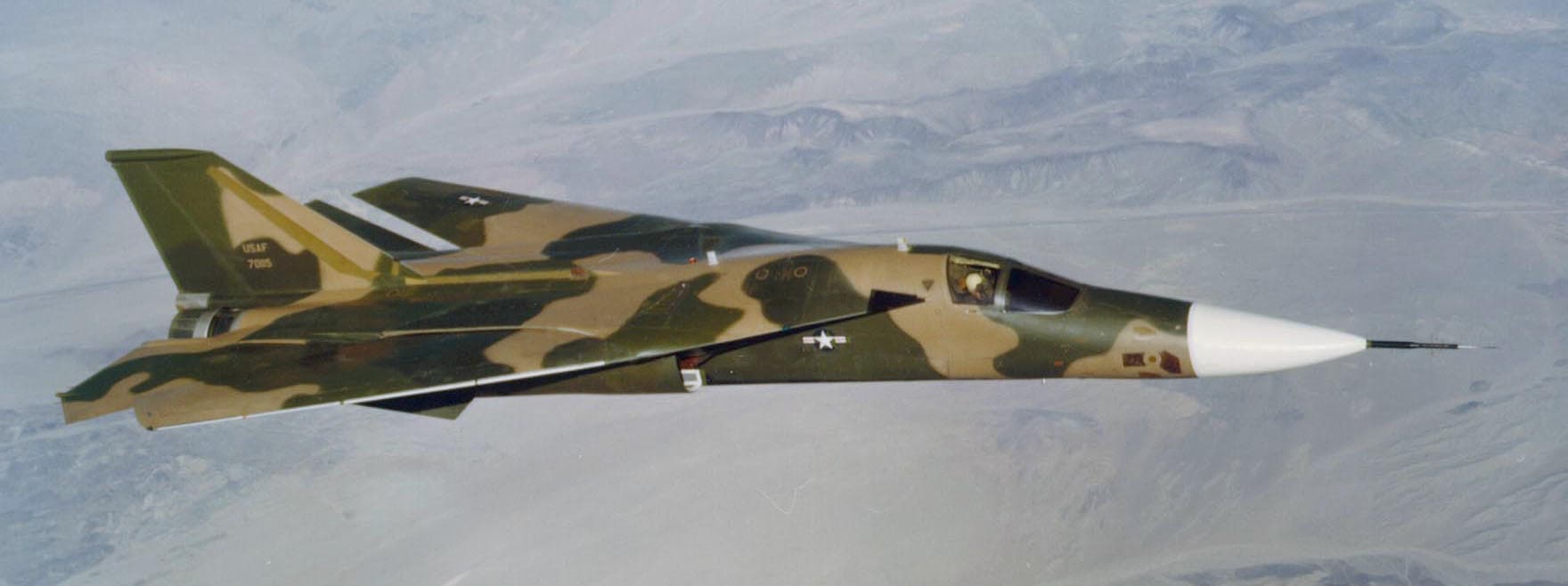 F-111 Aardvark in flight with wings swept back during a high-speed pass