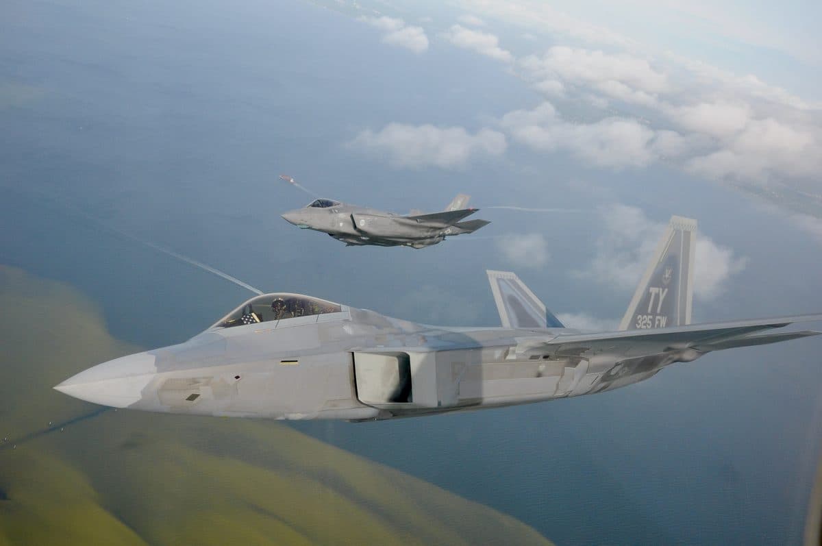 F-22 Raptor and F-35 Lightning II flying in formation over Florida's Emerald Coast