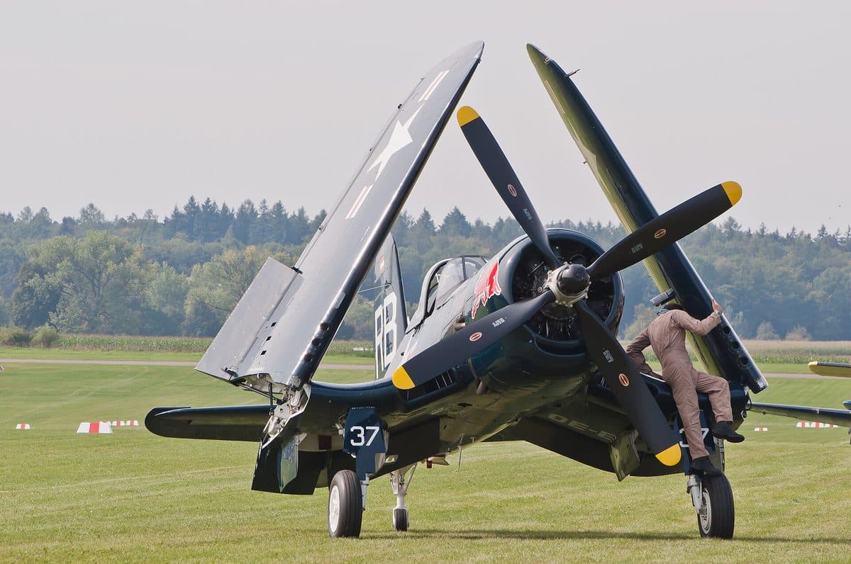 F4U Corsair fighter aircraft in flight showing its distinctive inverted gull wing design