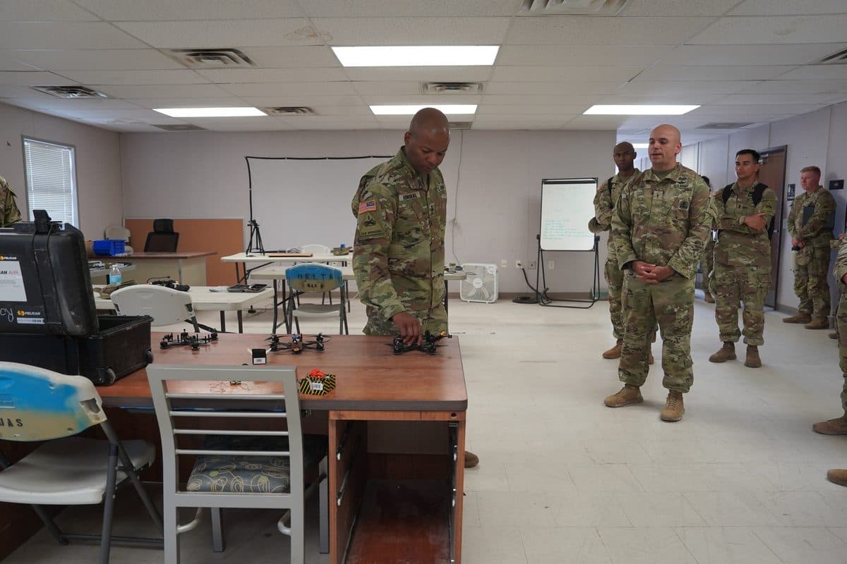 U.S. Army soldiers examining FPV drone technology during a demonstration of new capabilities