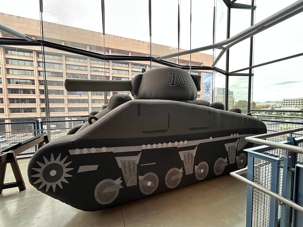 Soldiers of the 23rd Headquarters Special Troops positioning an inflatable decoy tank during World War II