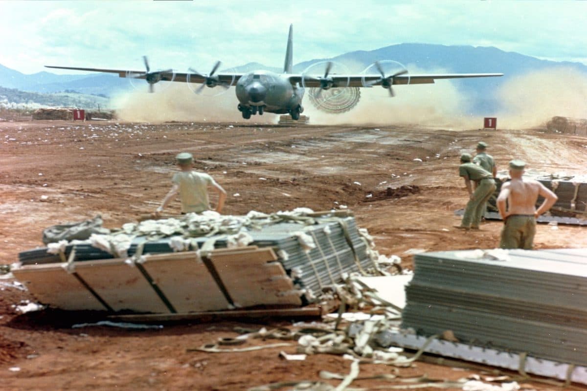 US Marines in foxholes at Khe Sanh combat base during the 1968 siege with fog-shrouded hills in the background