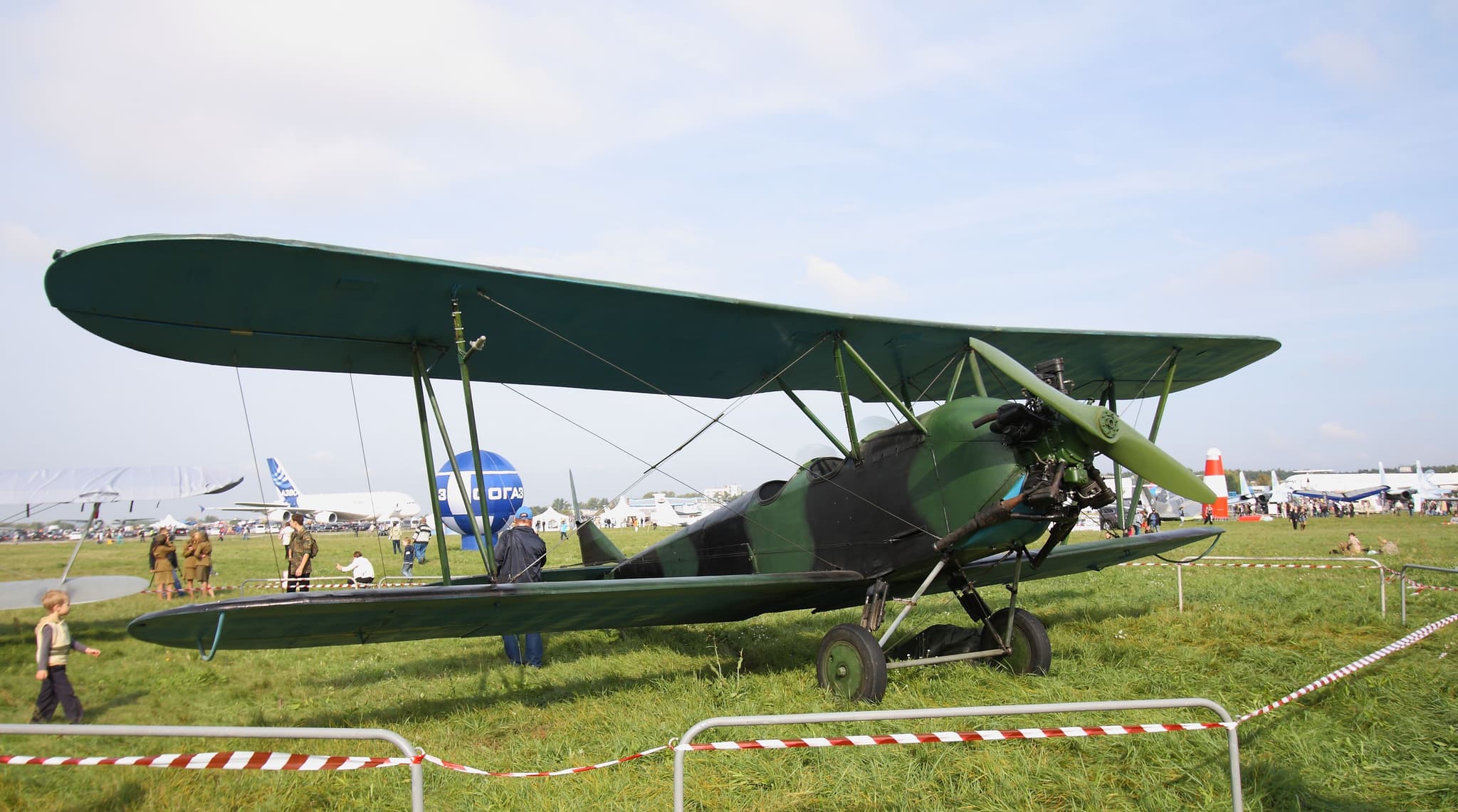 Polikarpov Po-2 biplane of the Night Witches 588th Night Bomber Regiment with crew preparing for a night mission