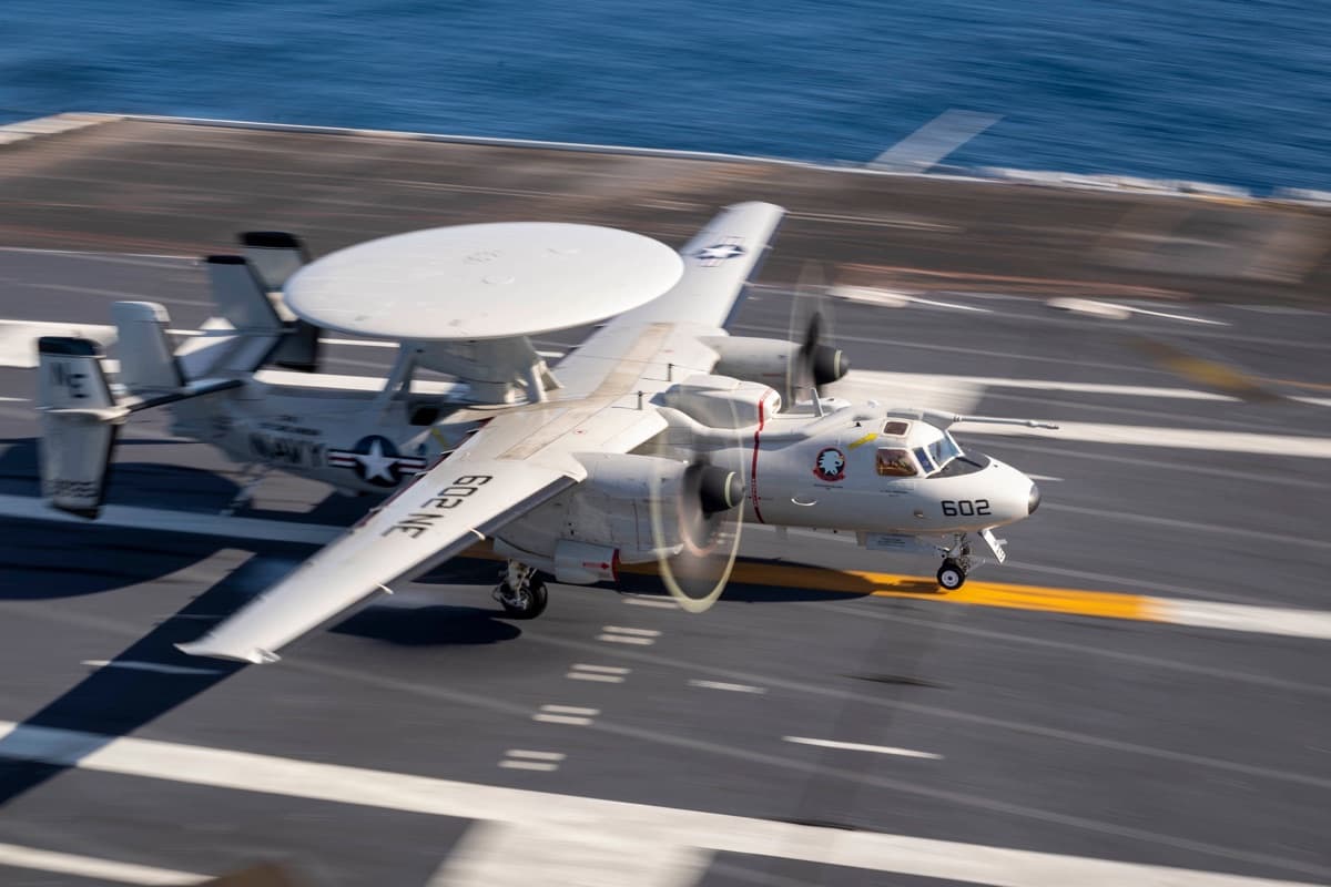 An E-2D Advanced Hawkeye aircraft landing on the flight deck of USS Carl Vinson