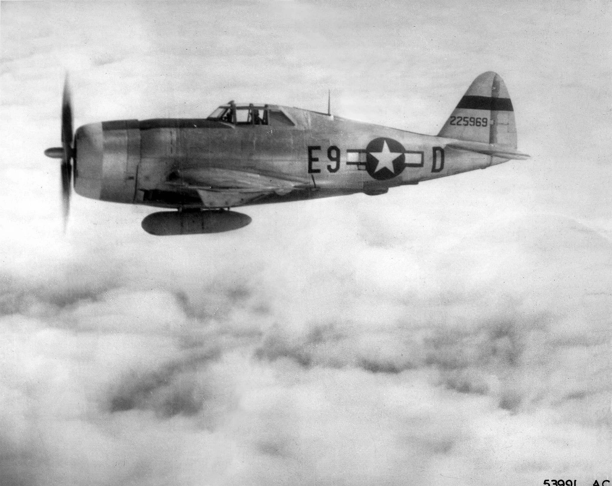 P-47 Thunderbolt fighter aircraft in flight showing its massive radial engine cowling and distinctive profile