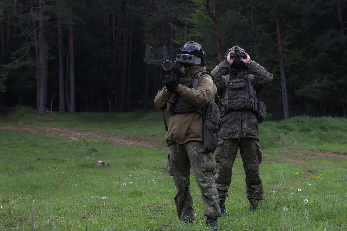 A soldier aims an FIM-92 Stinger surface-to-air missile system during a field exercise