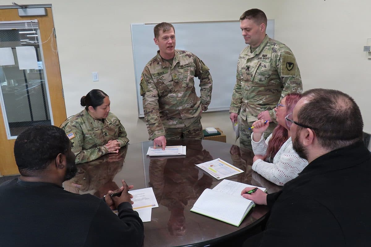 Red Ball Express supply convoy trucks lined up during World War II representing the critical role of military logistics