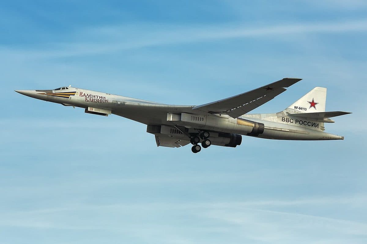 Tupolev Tu-160 Blackjack strategic bomber in flight showing its white paint scheme and swept wings