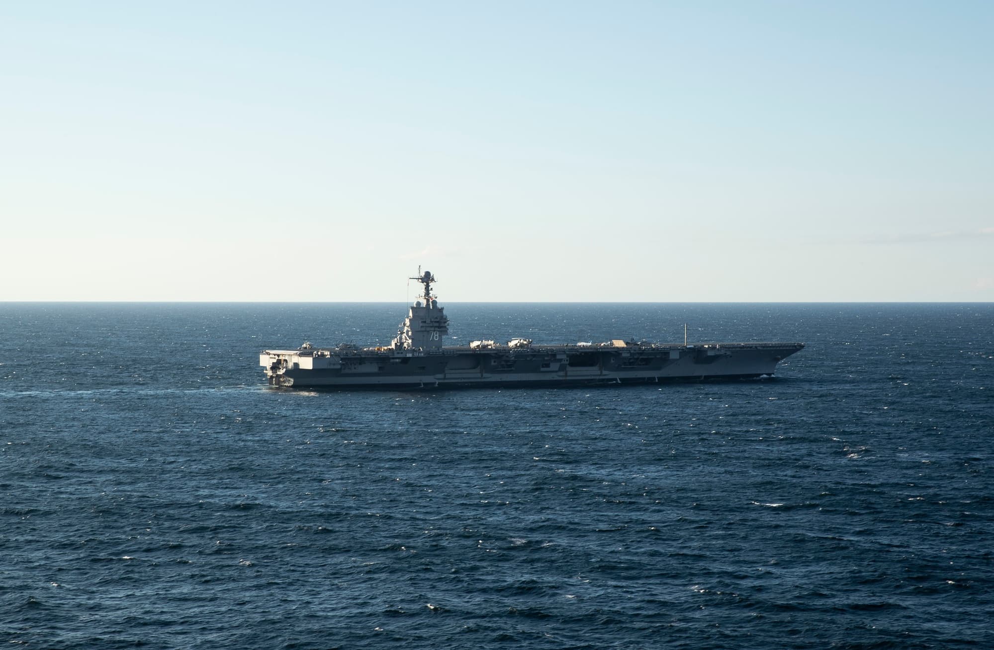 USS Gerald R. Ford aircraft carrier underway at sea with aircraft on the flight deck
