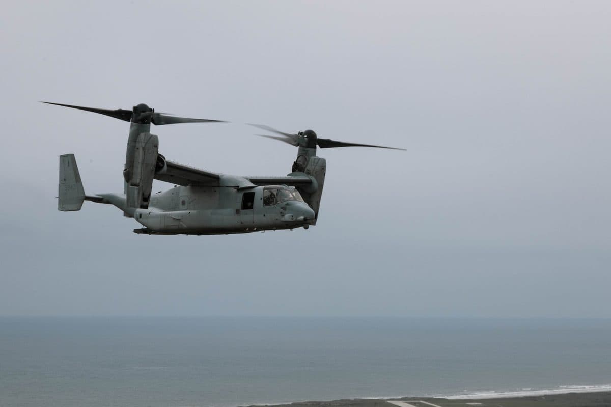 MV-22B Osprey tiltrotor aircraft in flight over Camp Pendleton with rotors in airplane mode