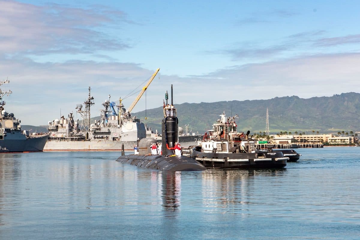 Virginia-class submarine surfacing at sea showing its modern hull design and sail