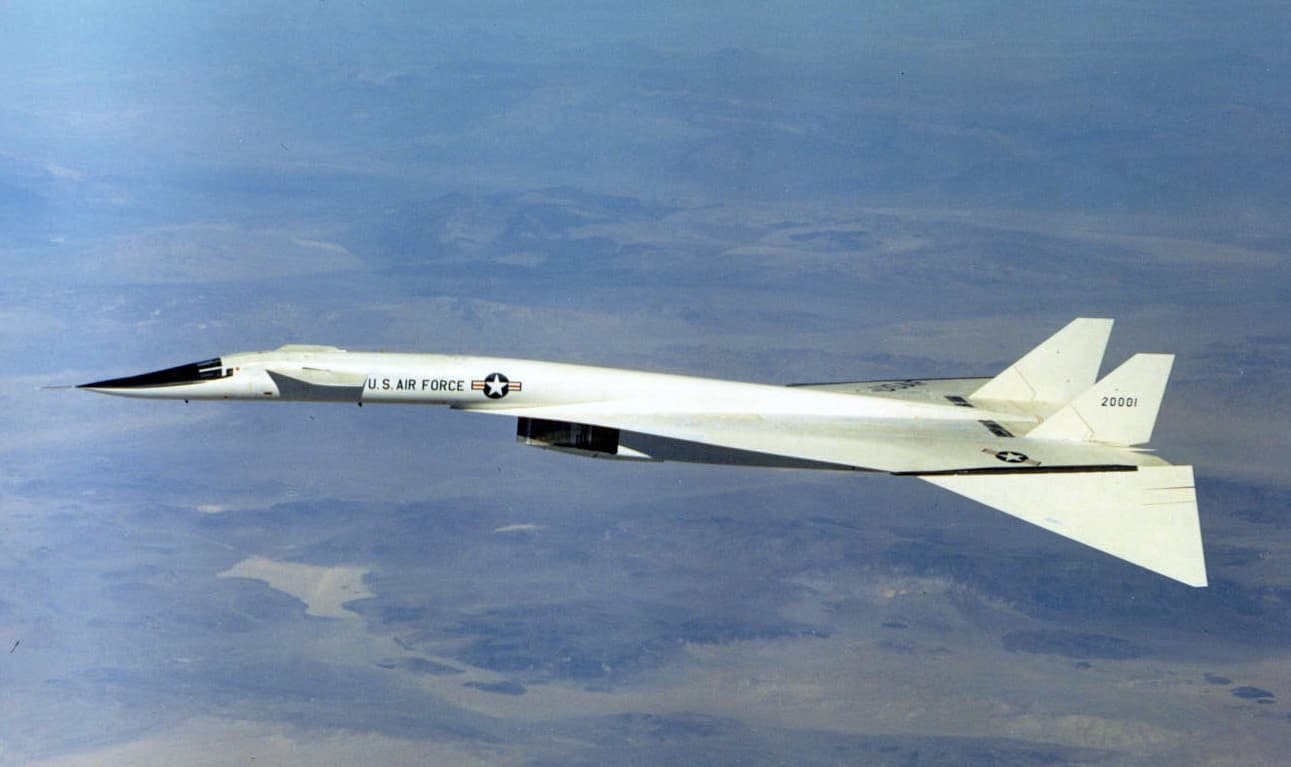 XB-70 Valkyrie in flight with wingtips drooped showing its distinctive white delta wing shape