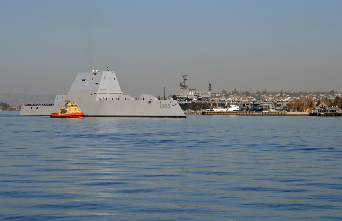 USS Zumwalt DDG-1000 stealth destroyer in San Diego Bay showing its angular tumblehome hull and composite deckhouse