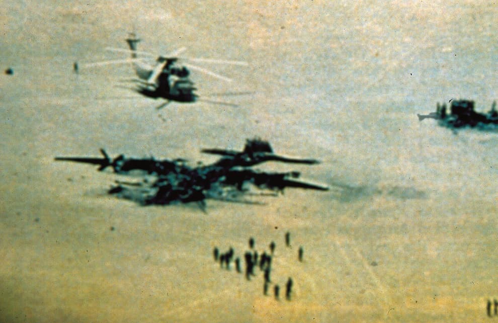 Burned wreckage of aircraft at Desert One, Iran, after the failed Operation Eagle Claw, April 1980