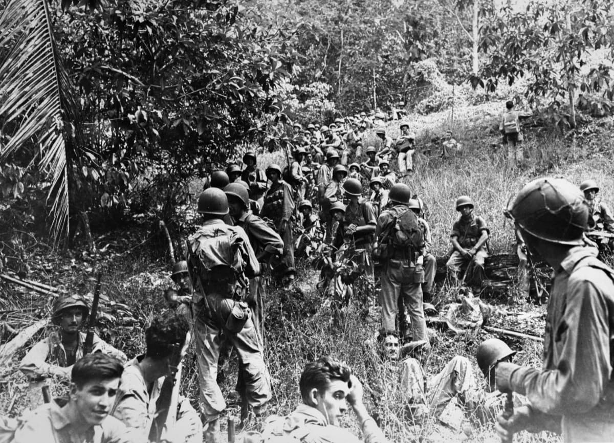 U.S. Marines advancing through the jungle on Guadalcanal during the 1942-43 campaign