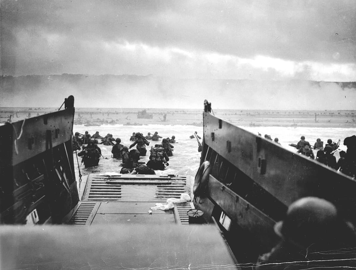 Allied forces advancing through the hedgerow country of Normandy after D-Day
