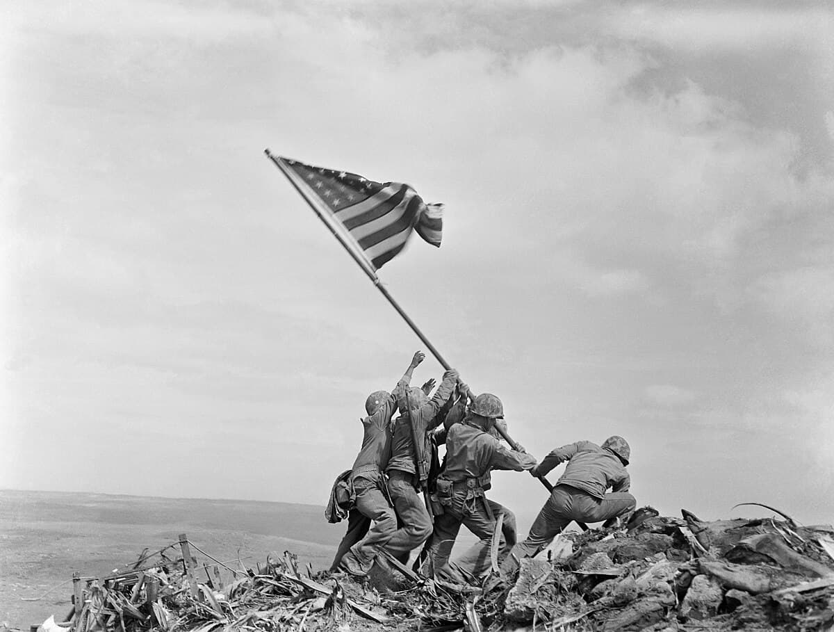 Marines raising the American flag on Mount Suribachi, Iwo Jima, the island was declared secure on March 26, 1945