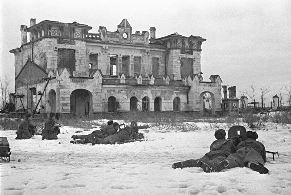 Soviet troops fighting through snow-covered forest during Operation Iskra to break the Siege of Leningrad, January 1943