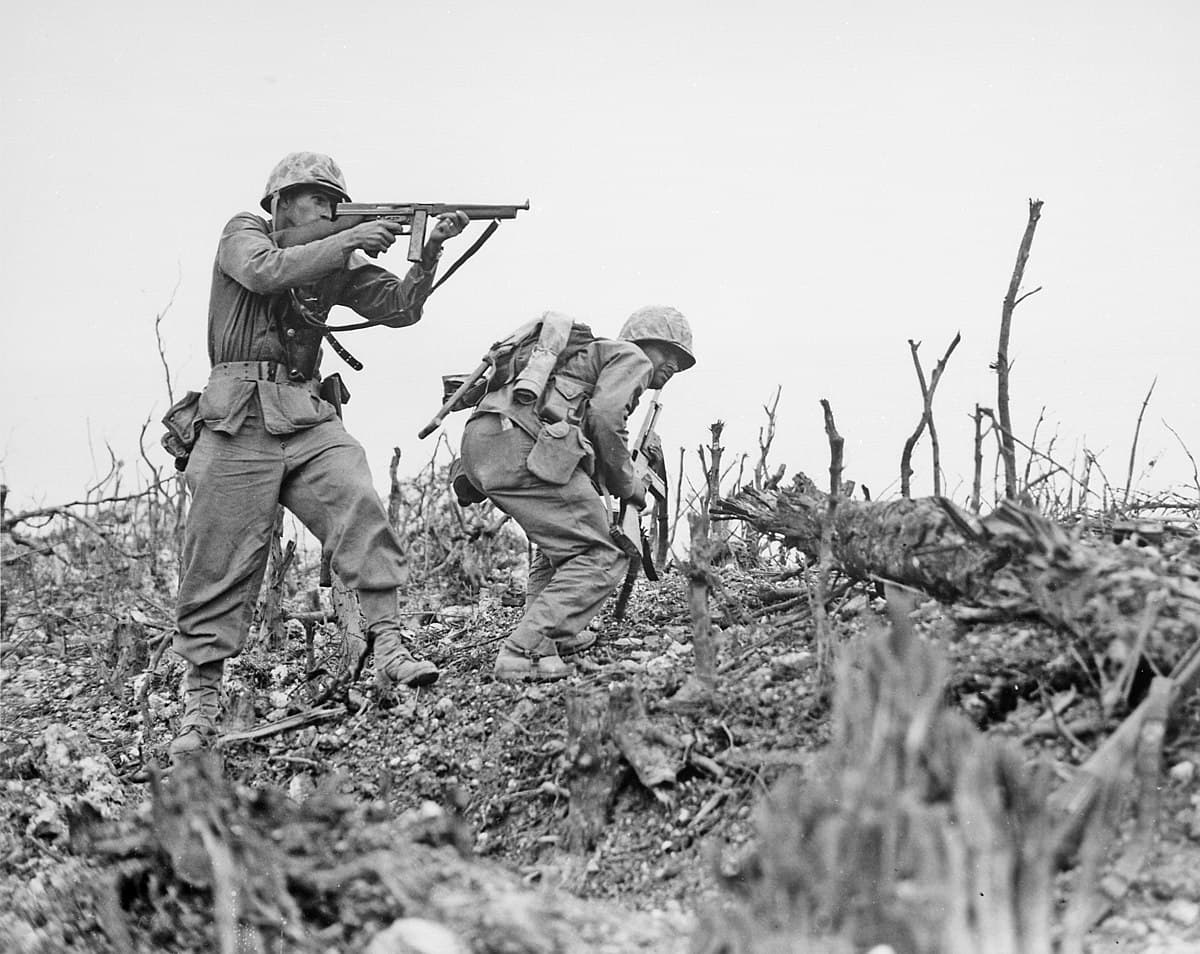 U.S. Marines advance through smoke and rubble during the Battle of Okinawa, April 1945