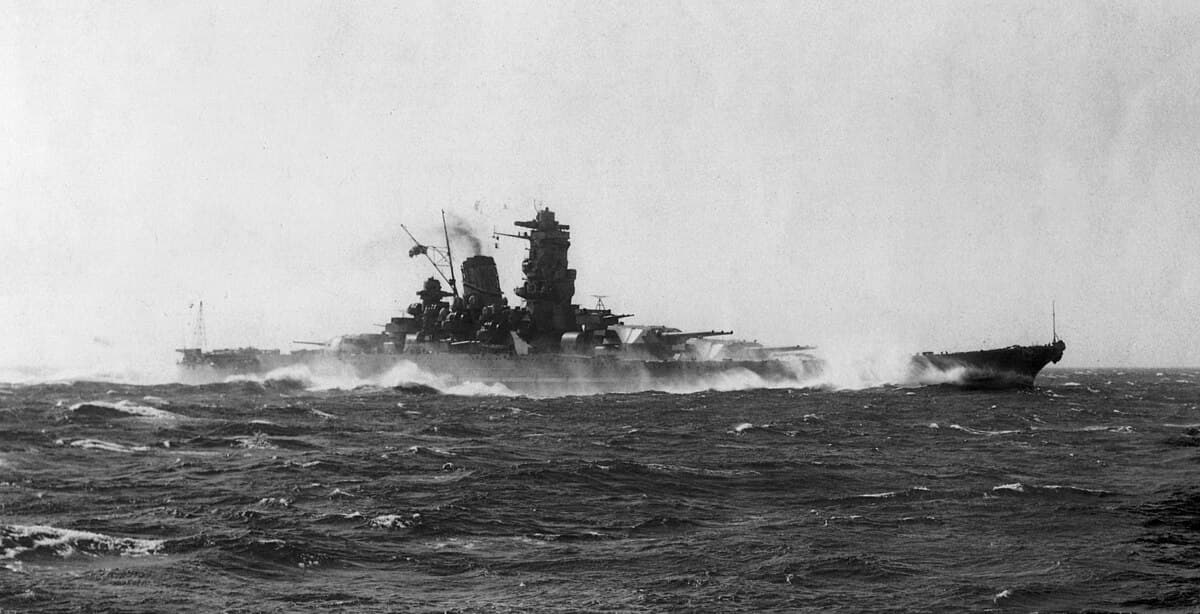 The Japanese battleship Yamato under heavy air attack, trailing smoke and listing, April 7, 1945