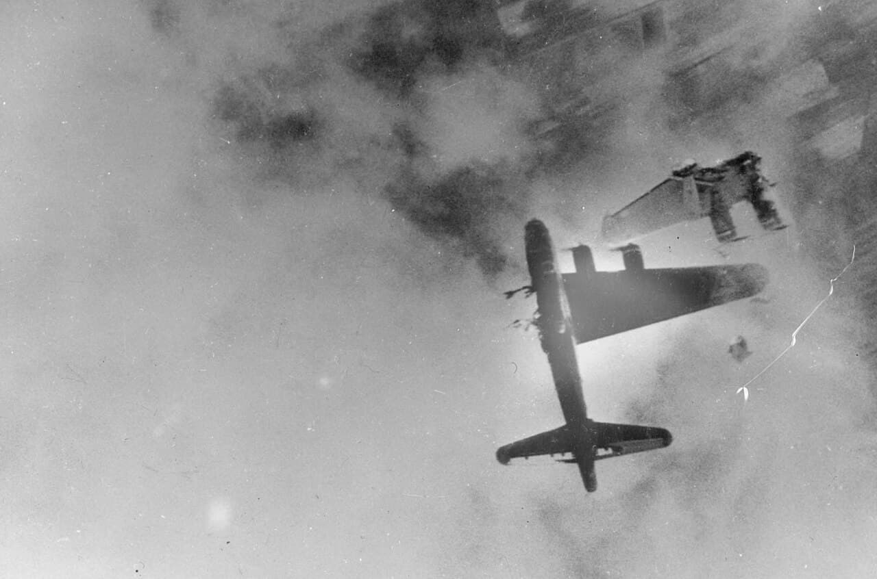 B-17 Flying Fortress with severe flak damage going down over Europe