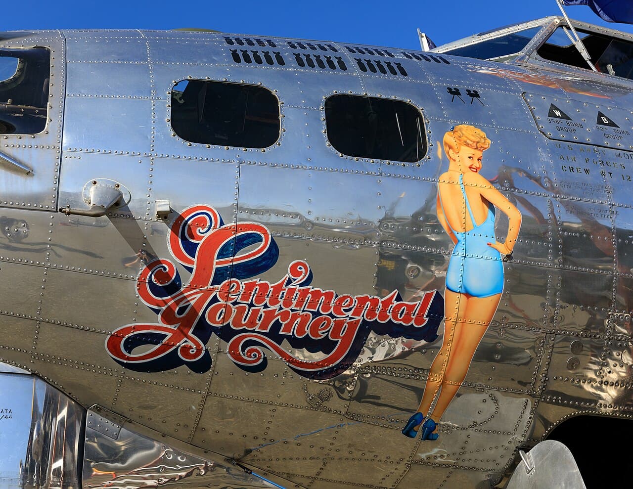 B-17 "Sentimental Journey" nose art showing a pin-up girl painting on the fuselage