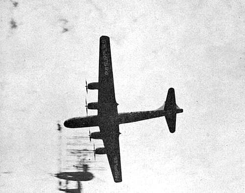 Boeing B-29 Superfortress on supply mission flying over Nagasaki, Japan, September 1945