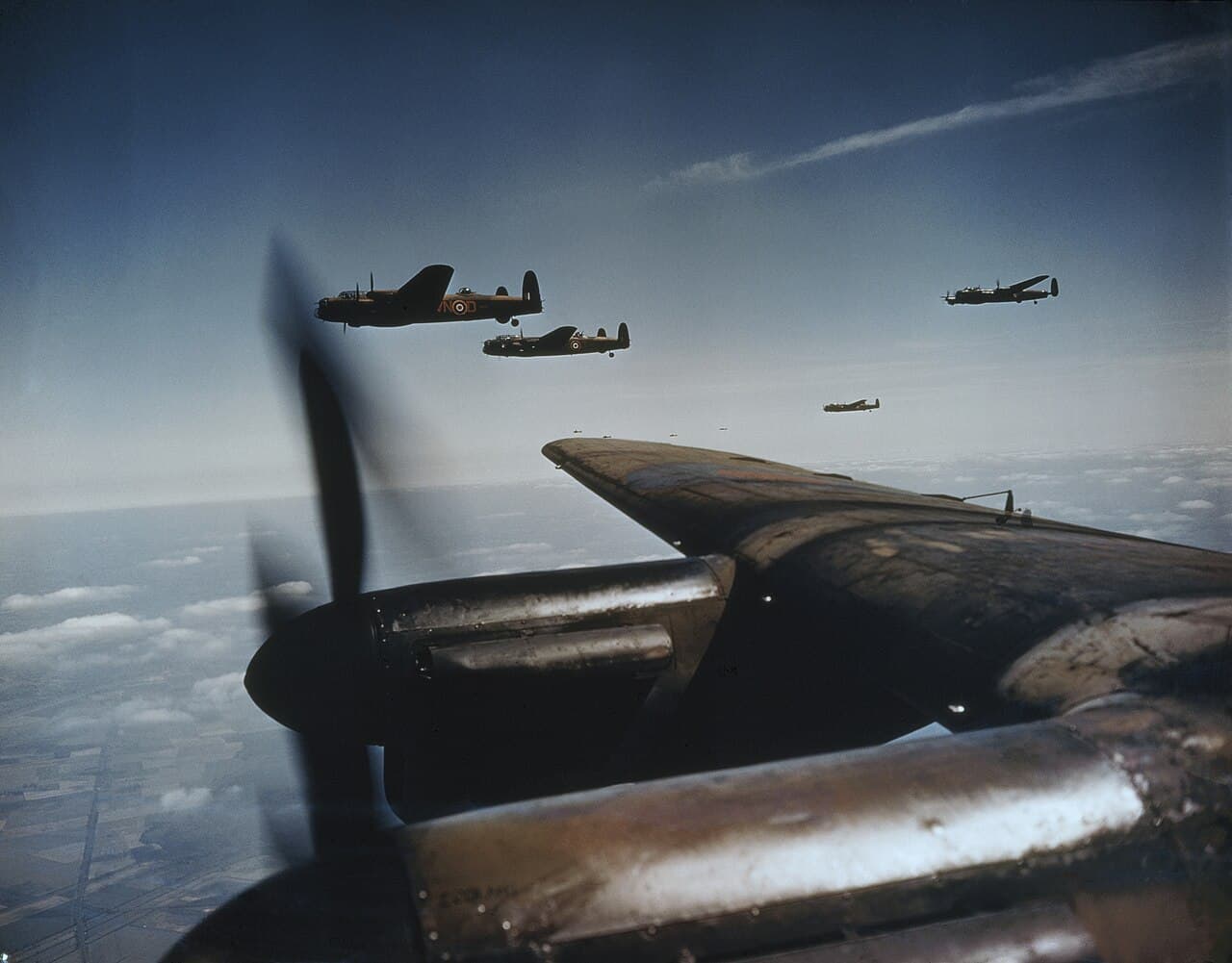 Avro Lancasters flying in loose formation during a Bomber Command operation