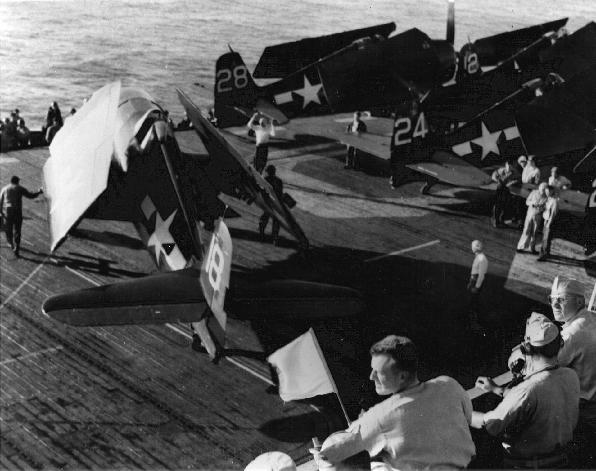 F6F Hellcats of VF-74 with wings folded on the flight deck of USS Kasaan Bay, 1944