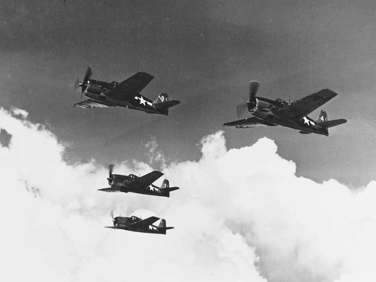 F6F Hellcats flying in formation over the Pacific Ocean, 1944