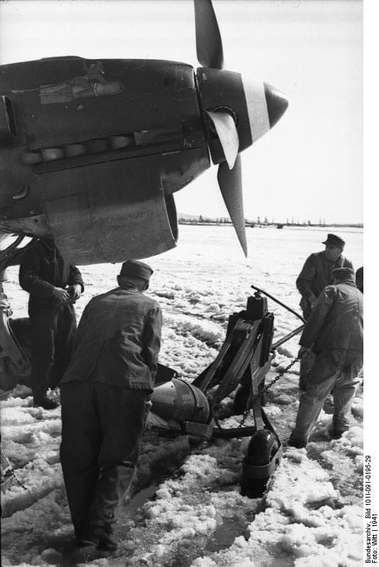 Ground crew loading a bomb onto a Ju 87 Stuka in Norway