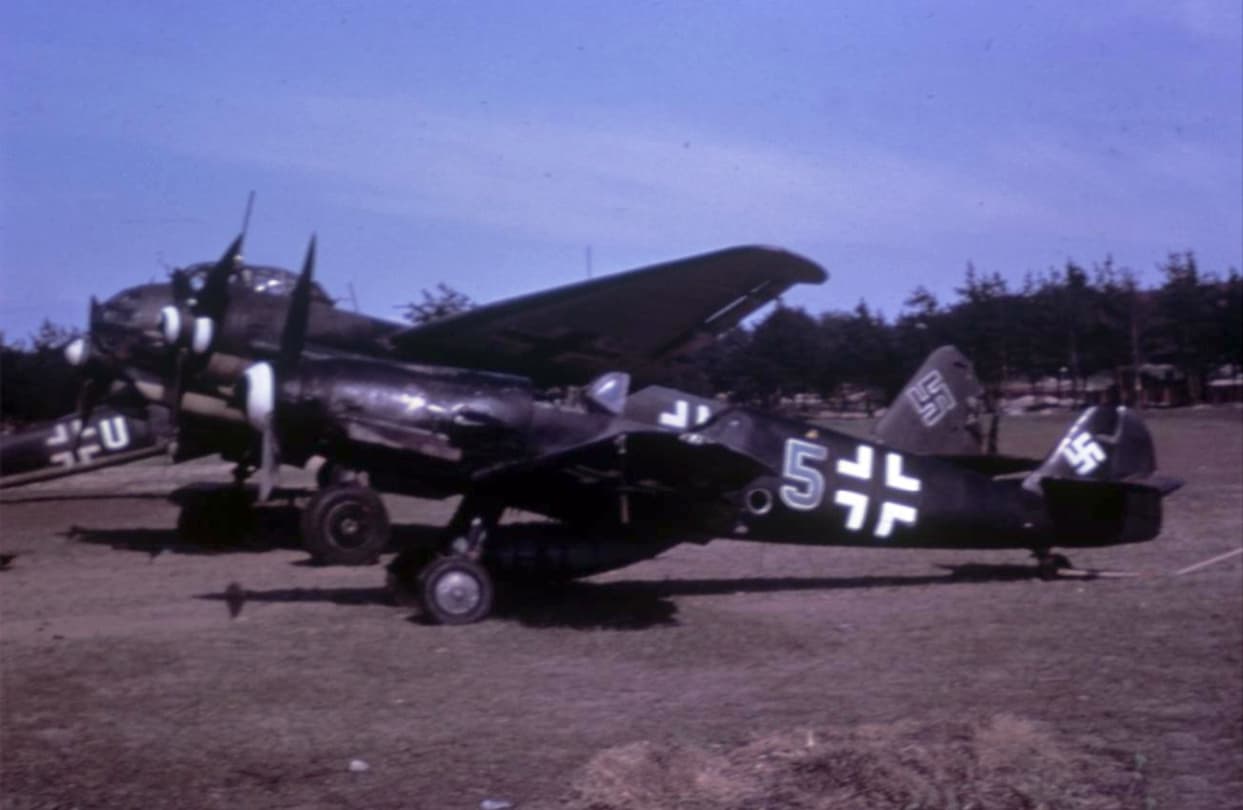 Bf 109 and Ju 88 at Gardelegen airfield, April 1945, color wartime photograph