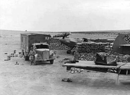 Captured Bf 109s at Fuka, North Africa, behind sandbag revetments, 1943