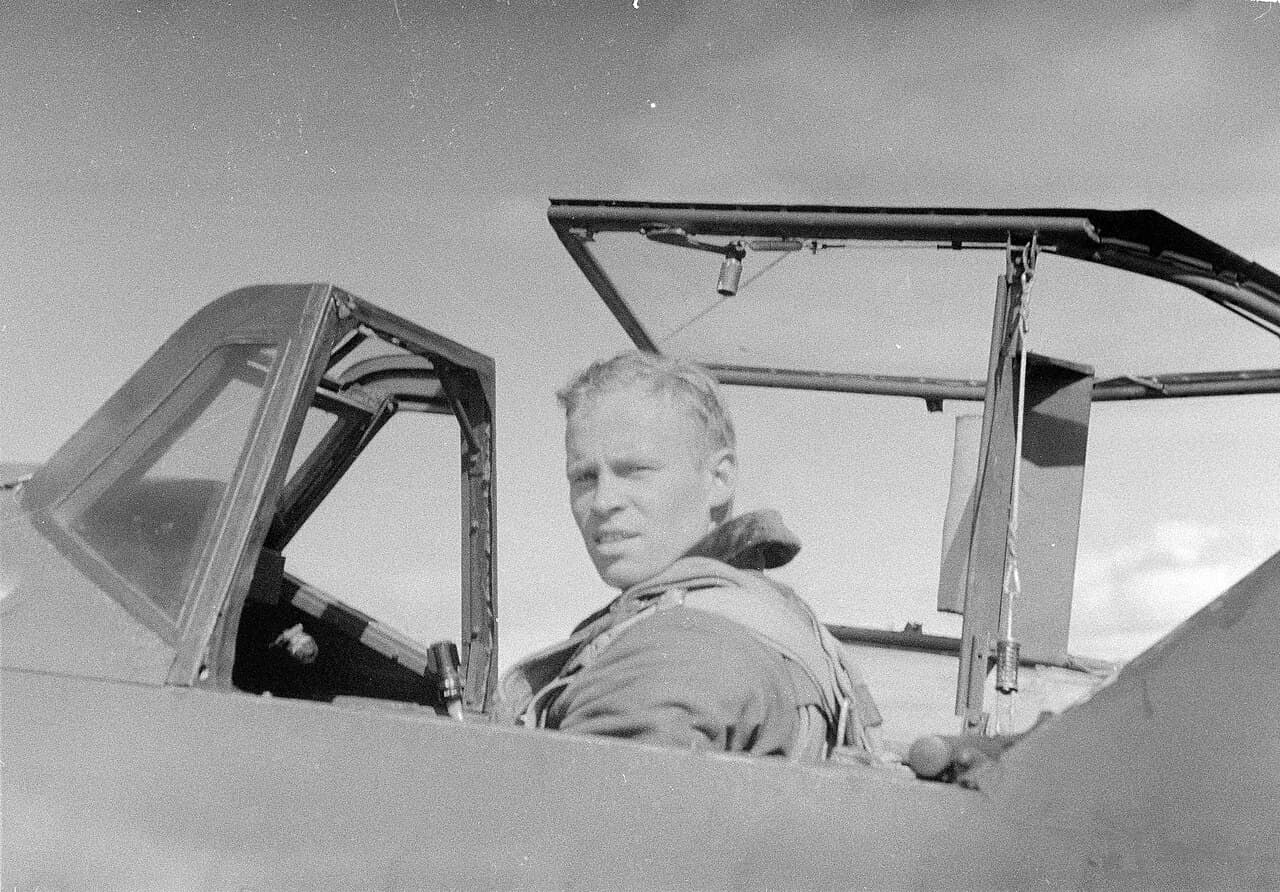 Finnish pilot Olavi Puro in the cockpit of a Bf 109G with canopy open, mid-1944