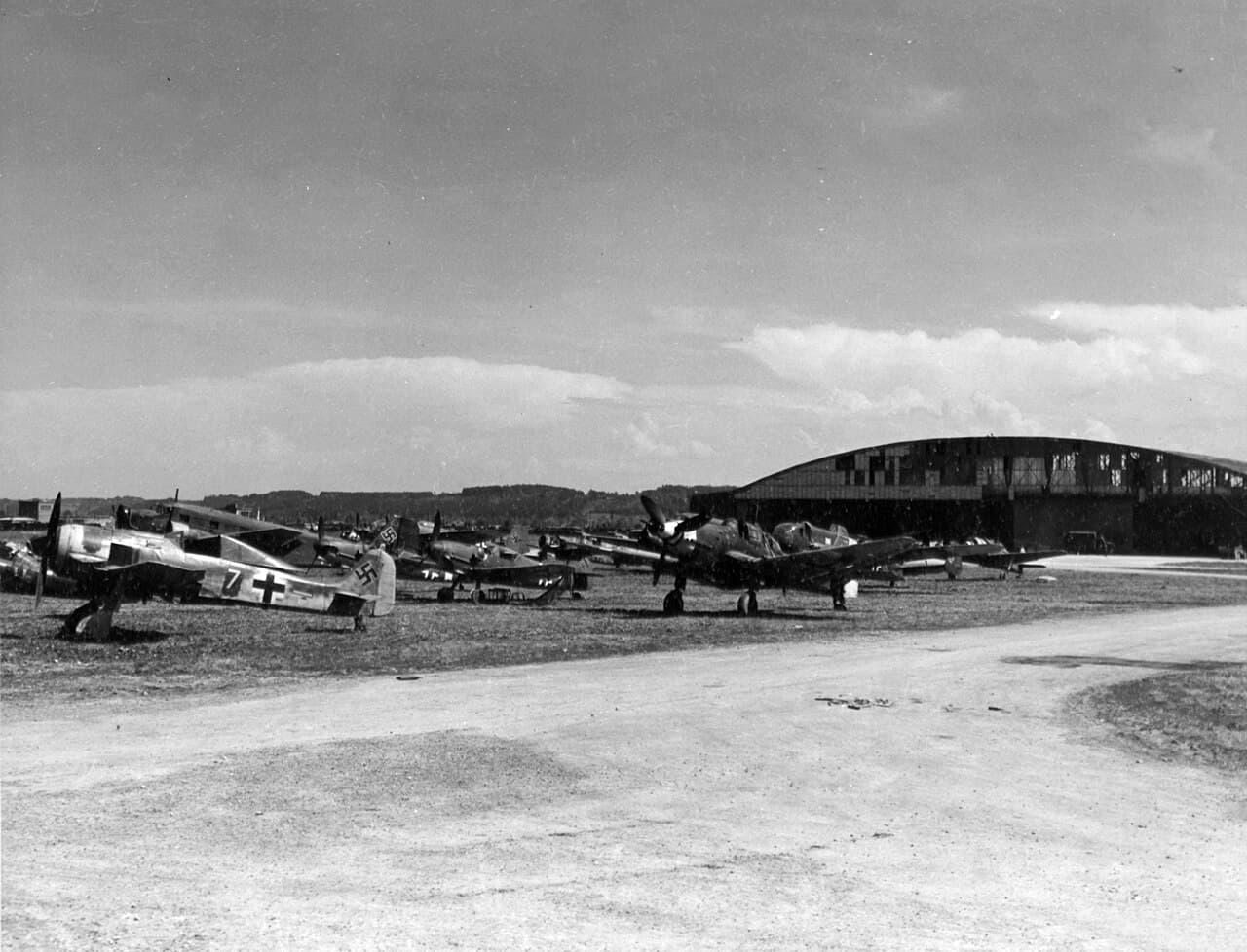 Multiple Bf 109 fighters on the flight line at Wels airfield, Austria, May 1945