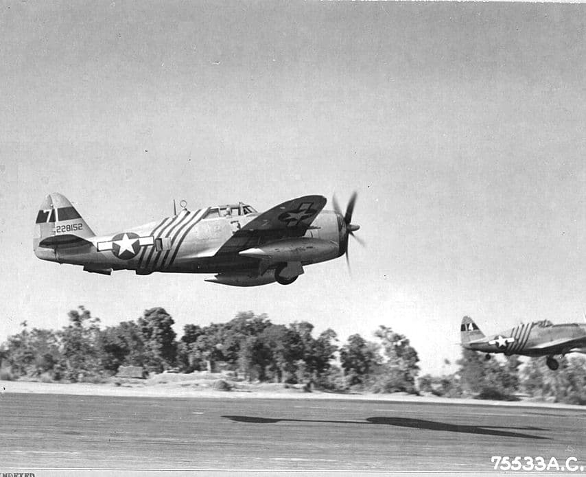 P-47D Thunderbolts of the 1st Air Commando Group taking off in formation with distinctive striped markings