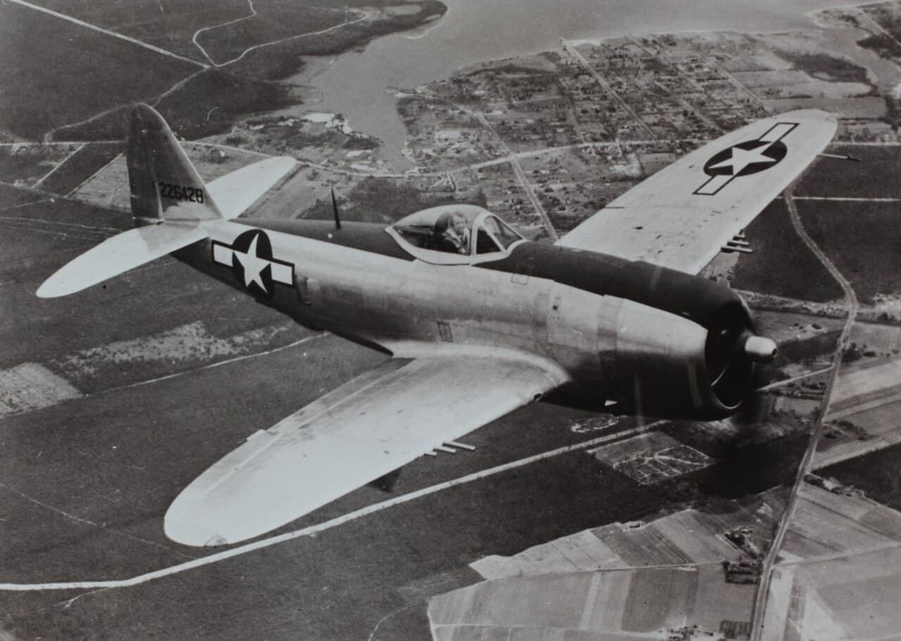P-47D-25 Thunderbolt in flight showing the aircraft's bubble canopy and massive proportions