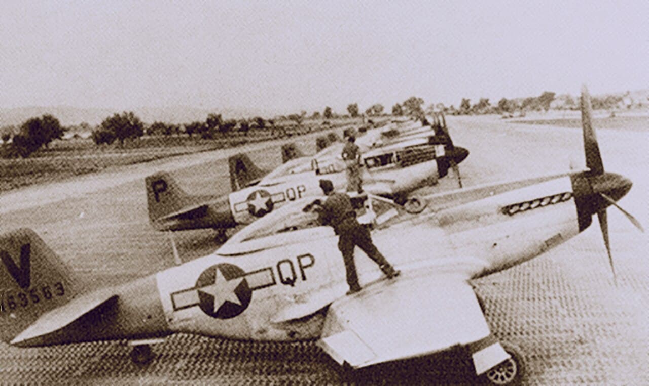 P-51D Mustangs of the 15th Air Force lined up at Madna airfield, Italy, 1944